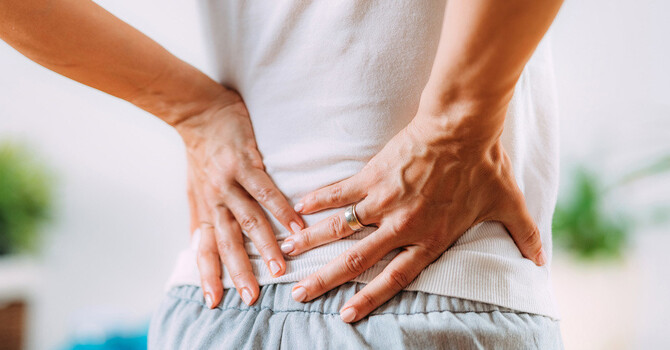 Causes of Lower Back Pain in Women (& How to Safely Treat It)  image